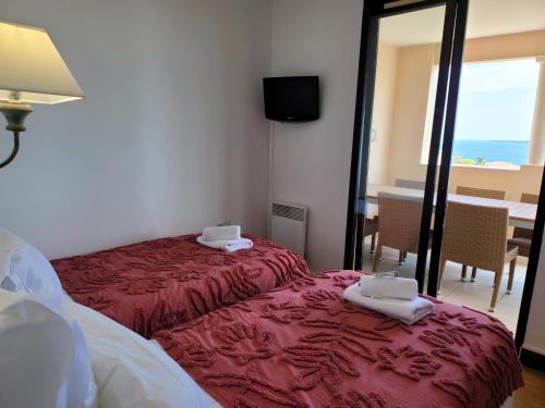 Ένα ή περισσότερα κρεβάτια σε δωμάτιο στο T2 + CABINE VILLA FRANCIA