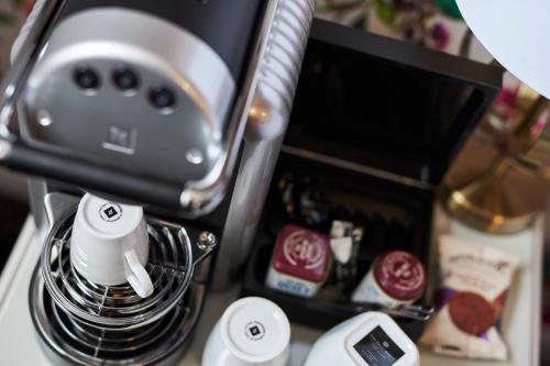 a coffee maker sitting on top of a counter at Quilt and Croissants Guest House in Stratford-upon-Avon