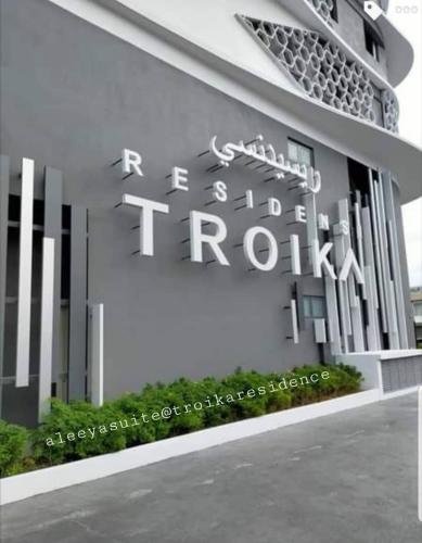 una representación de un edificio con una señal en él en Aleeya Suite @ Troika Residence, en Kota Bharu