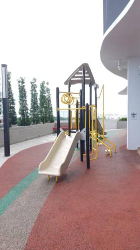 a playground with a slide in a building at Aleeya Suite @ Troika Residence in Kota Bharu