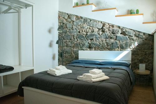 A bed or beds in a room at Ghè House