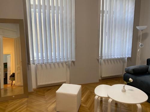 a living room with a couch and a table at MQ Appartement in Vienna