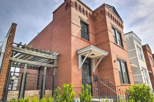 a red brick building with a large window at 2 Mi to National Mall Modern DC Retreat with Patio in Washington, D.C.