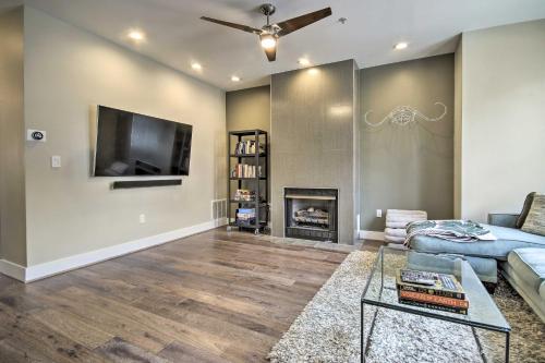 a living room with a fireplace and a tv at 2 Mi to National Mall Modern DC Retreat with Patio in Washington, D.C.