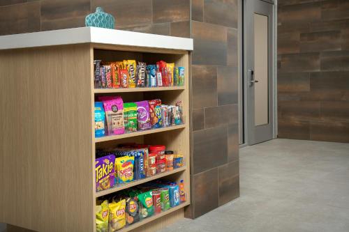 a walk in pantry filled with lots of snack foods at Home2 Suites By Hilton Tampa Westshore Airport, Fl in Tampa