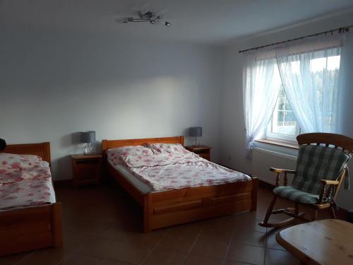Ένα ή περισσότερα κρεβάτια σε δωμάτιο στο Gospodarstwo Agroturystyczne Cyrson