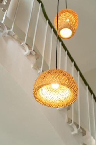 a group of lights hanging from a set of stairs at Hotel Aubí in Sant Antoni de Calonge