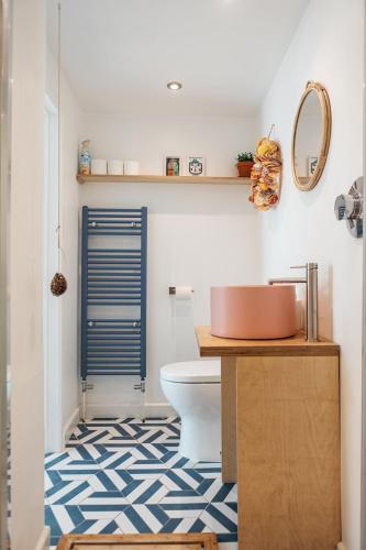 a bathroom with a toilet and a sink at Stunning views over the beautiful Falmouth Harbour in Falmouth