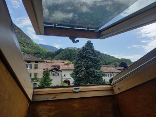 a view from the inside of a room with a window at Garni Meinrad in Ora/Auer