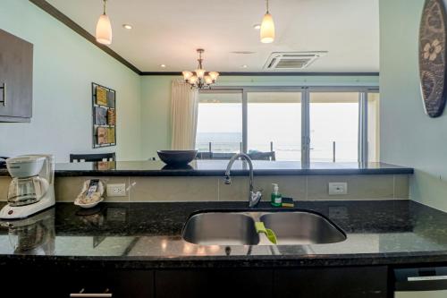 a kitchen with a sink and a counter top at Diamante del Sol 602N in Jacó