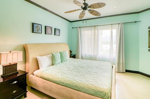 a bedroom with a bed and a ceiling fan at Diamante del Sol 602N in Jacó