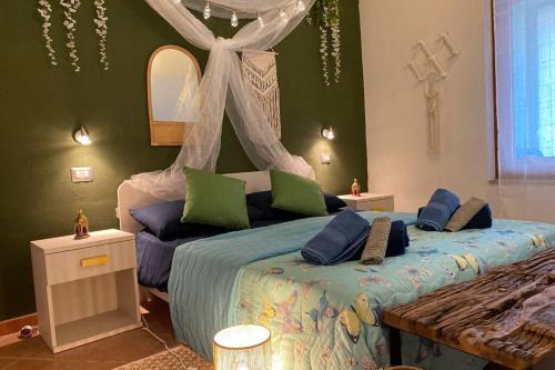 a bedroom with two beds with a canopy at Boho Chic Beach Resort in Sardegna in Porto Istana