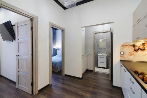 a room with a bedroom with a bed and a mirror at Стильна квартира в самому центрі in Lviv