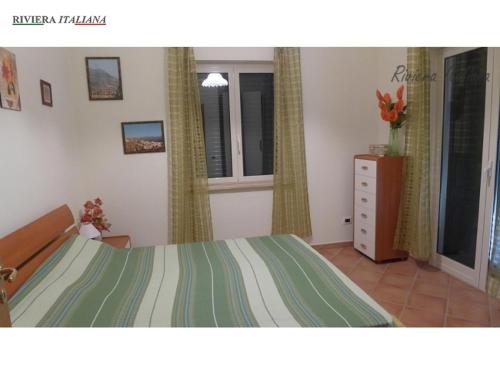 Ένα ή περισσότερα κρεβάτια σε δωμάτιο στο Villa Parco Meridiana