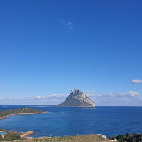 an island in the middle of a large body of water at Appartamento Vasiliki in Porto San Paolo
