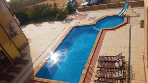 an overhead view of a swimming pool in a building at Apartments Paskalina in Byala