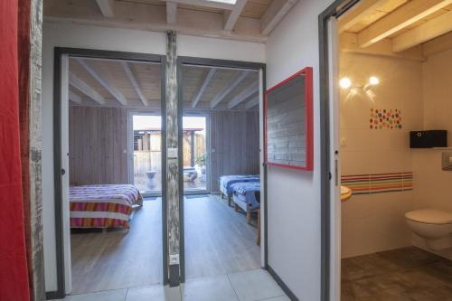 a room with a sliding glass door leading to a bedroom at L Escale Tranquille in Andernos-les-Bains