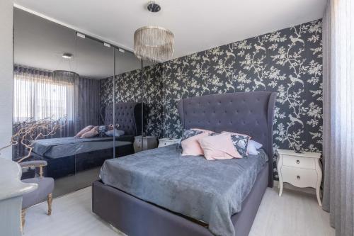 a bedroom with two beds and a mirror at Boutique Style – 2 Bedroom Apartment- Ta’Xbiex, Sliema area in Taʼ Xbiex