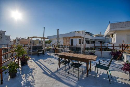 a patio with a table and chairs on a balcony at Mascot Boutique Hotel in Rhodes Town