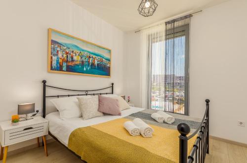 a bedroom with a large bed and a window at SILVER luxury in Pula