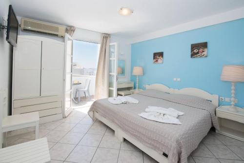 Letto o letti in una camera di Georgia Mare