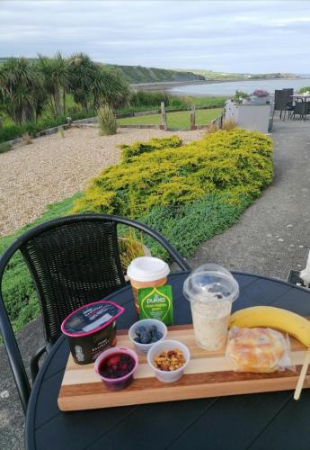 a tray of food on top of a table at Wild Atlantic Lodge Bed & Breakfast in Lahinch