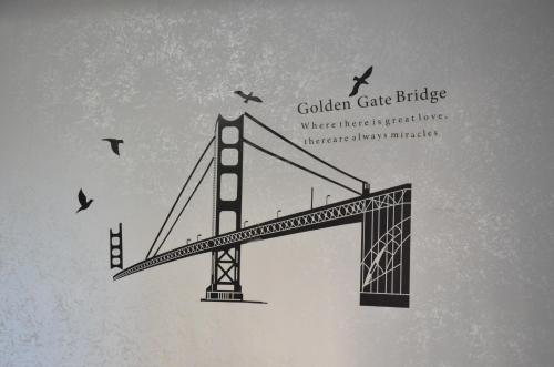 a drawing of the golden gate bridge with birds at Hostel California in Batumi