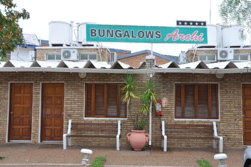 a brick building with a sign that reads bunionsickets at Bungalows Archi in Termas del Daymán