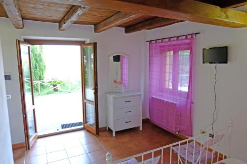a room with a dresser and a pink door at Il Parco in Ancona