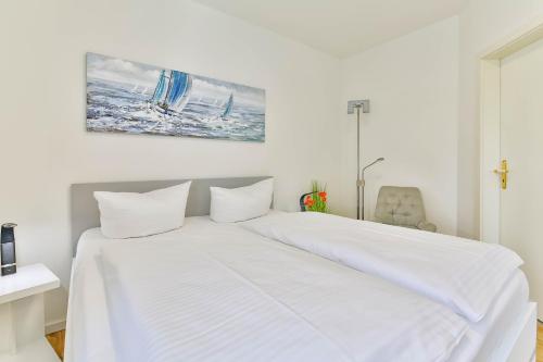 Katil atau katil-katil dalam bilik di Ferienwohnung Tine mit Balkon, Fahrrädern und Strandkorb im Sommer