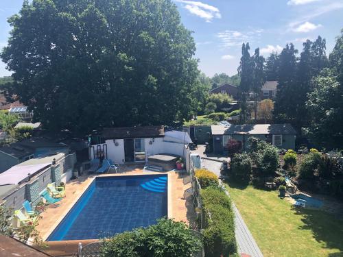 an aerial view of a house with a swimming pool at Hazelwick in Hookwood