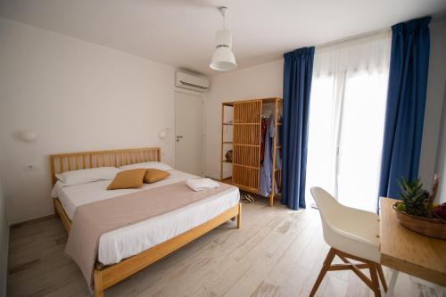 Postel nebo postele na pokoji v ubytování TiPino