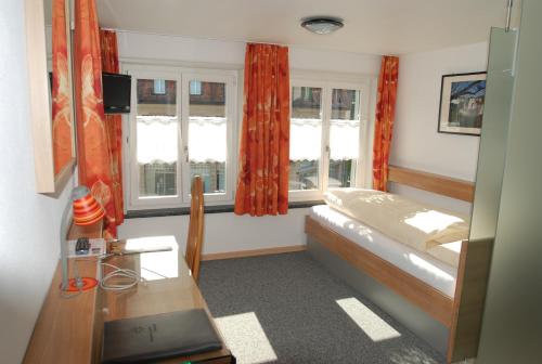 Ein Bett oder Betten in einem Zimmer der Unterkunft Gästehaus Sonne