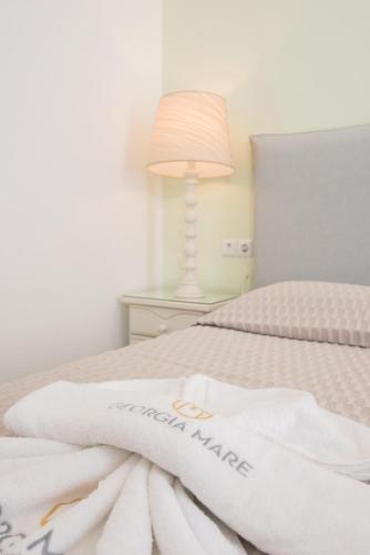 Letto o letti in una camera di Georgia Mare