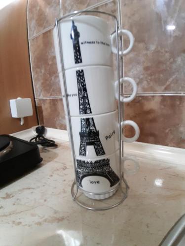 a glass jar with the eiffel tower on it at Goka apartments in Gevgelija