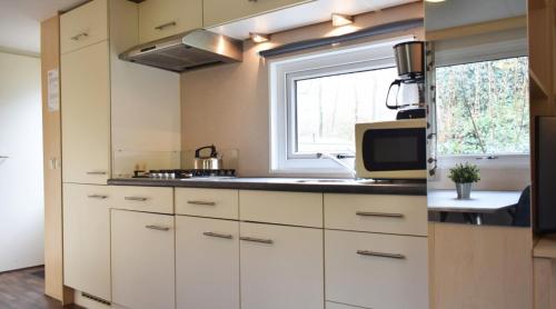 Dapur atau dapur kecil di Heidepark Veluwschkarakter