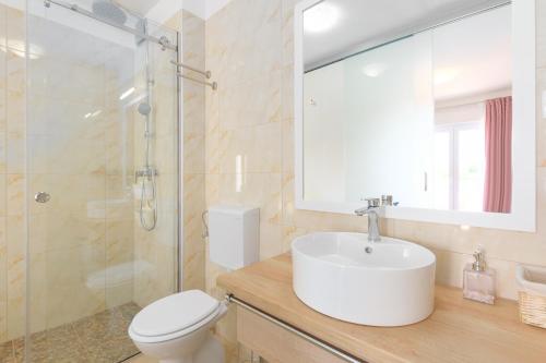 a bathroom with a sink and a shower and a toilet at Relaxing villa Mala vala in Fažana