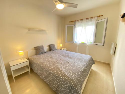 A bed or beds in a room at Oasis Park El Conserje