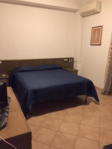 Ένα ή περισσότερα κρεβάτια σε δωμάτιο στο Casa Elisa
