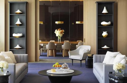 a living room with a couch and a table at Four Seasons Hotel Kuwait at Burj Alshaya in Kuwait