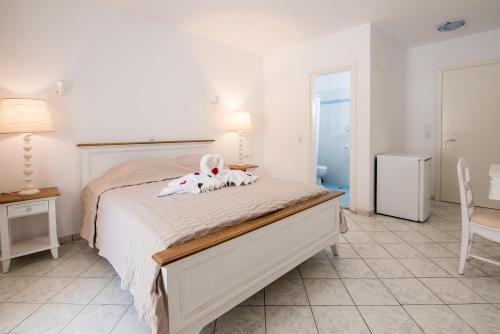Letto o letti in una camera di Georgia Mare