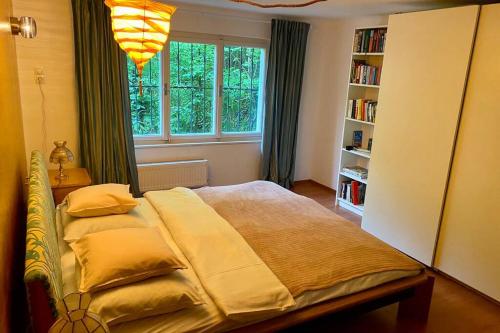 Posteľ alebo postele v izbe v ubytovaní Ferienappartement Bellevue Wörthersee - privater Seezugang, Hunde auch herzlich willkommen