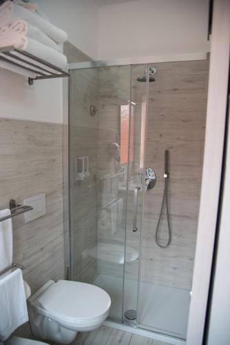 a bathroom with a glass shower with a toilet at VISTAMARE VILLAGE in Silvi Marina