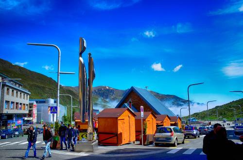 a group of people walking on a street with a building at Hotel Terranova in Pas de la Casa