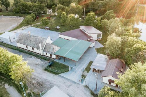 an aerial view of a house with a swimming pool at Tíztó Vendégház in Baja