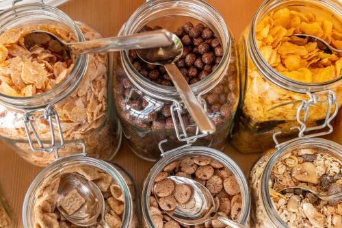 a group of jars filled with different types of food at Panoramahotel Stocker in Pruggern