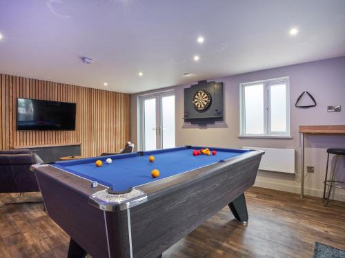 a pool table with balls on it in a room at Upper Sheriff's Place in Windermere