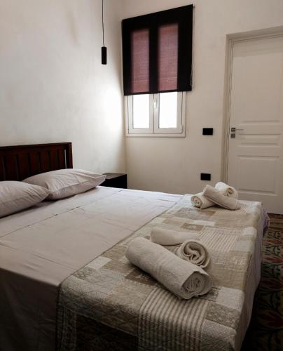 A bed or beds in a room at Loft Marettimo Egadi