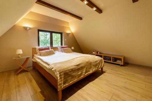 En eller flere senge i et værelse på Pensjonat Pod Świerkami