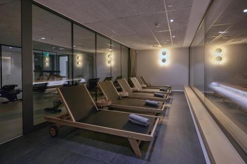 a row of chairs in a waiting room at Triangel Boutique Hotel in Kranjska Gora